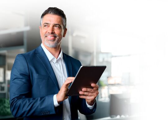 Executive reviewing results on a tablet