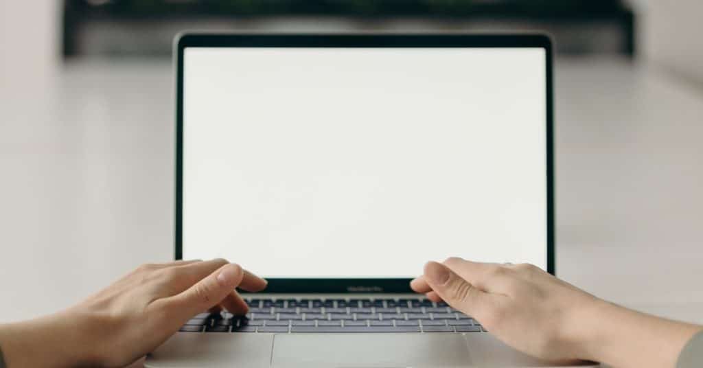 A laptop with a white screen