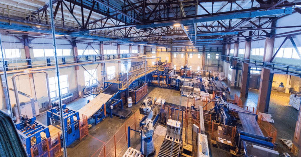 Industrial leader navigating the 2025 U.S. reshoring and tariff strategy in a modern factory setting – Kilpatrick Executive